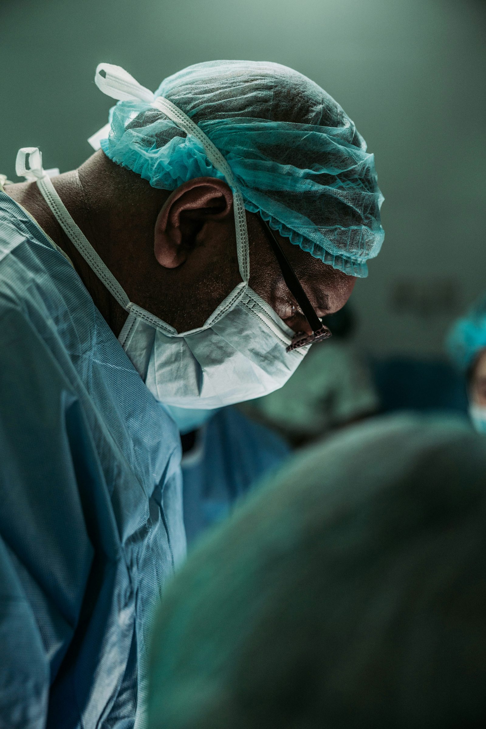 Surgeon in scrubs and mask
